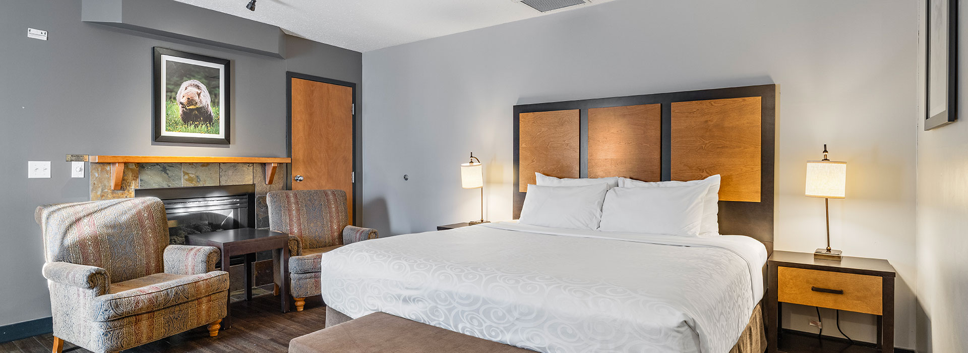 Executive king suite with fireplace and seating area