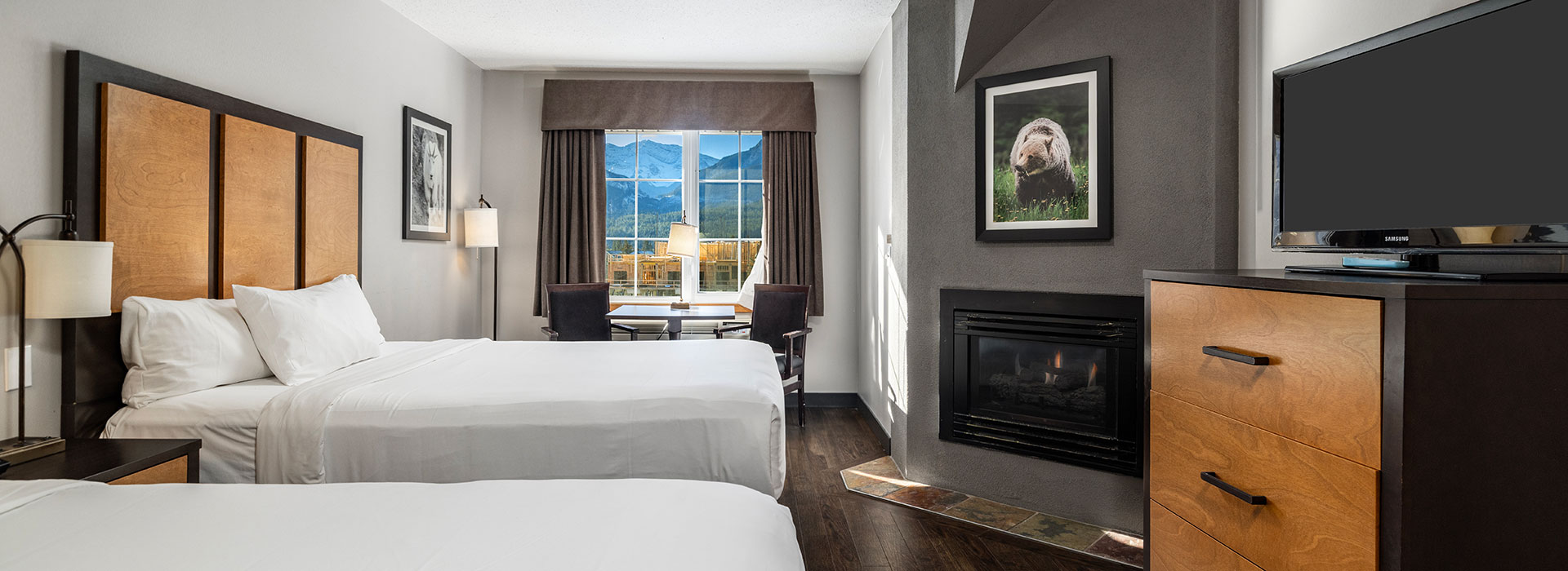 Hotel room with two queen beds and mountain views