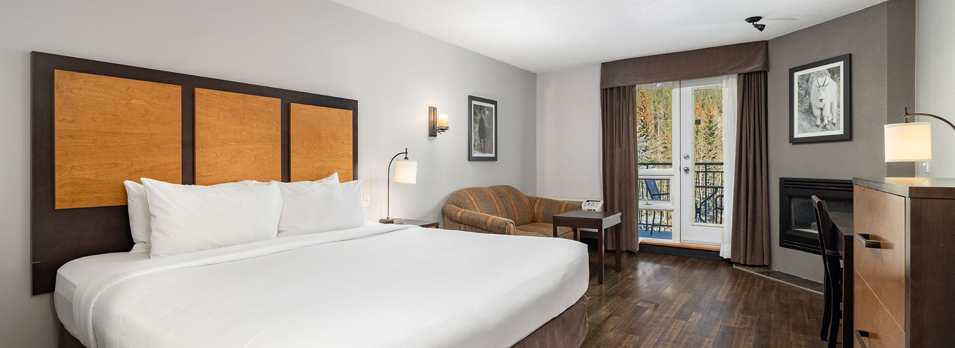 Hotel room with king bed, seating and balcony